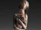 A free standing study of a Mother talking tenderly to her Baby.
Patinated in a mid bronze.