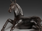 A free standing sculpture of a Horse on the point of rising.
Patinated in a dark bronze.
