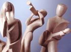 A group of six individual musicians, playing their instruments which are the Saxophone, Drums,  Bass, Trumpet, Guitar and the Singer. The Art Deco lines of these stylised figures, all with their individually shaped bases, form an amusing group but could be displayed singularlyThe figures are cast either in marble resin or bronze resin.